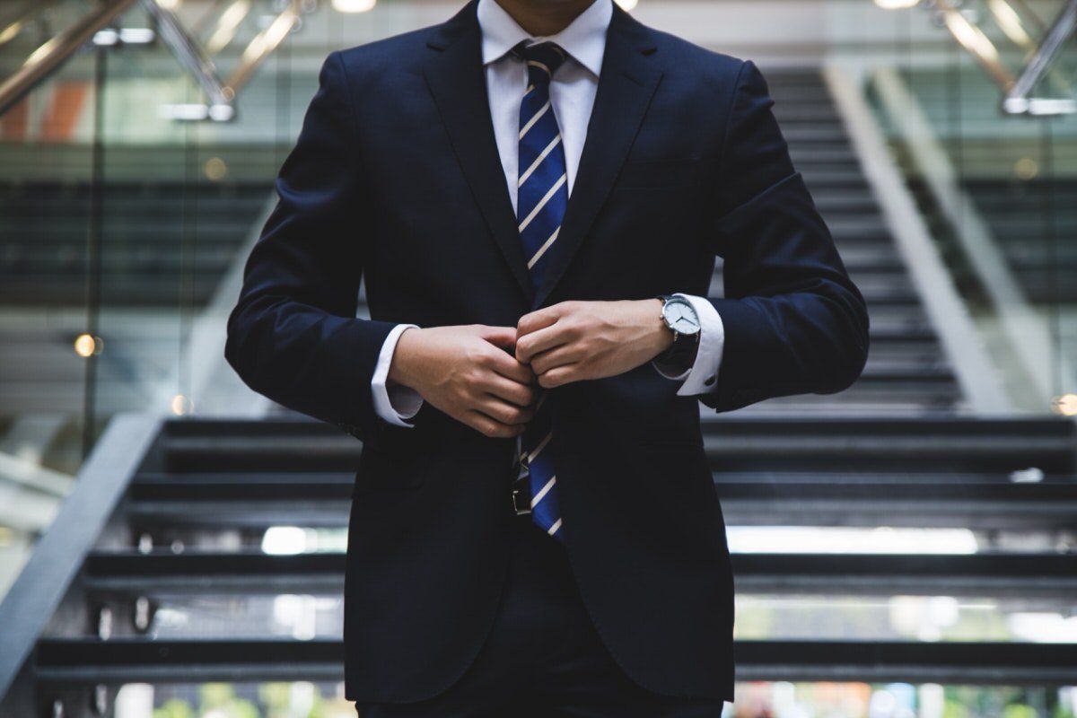 A chartered accountant in British Columbia in front of the staircase.